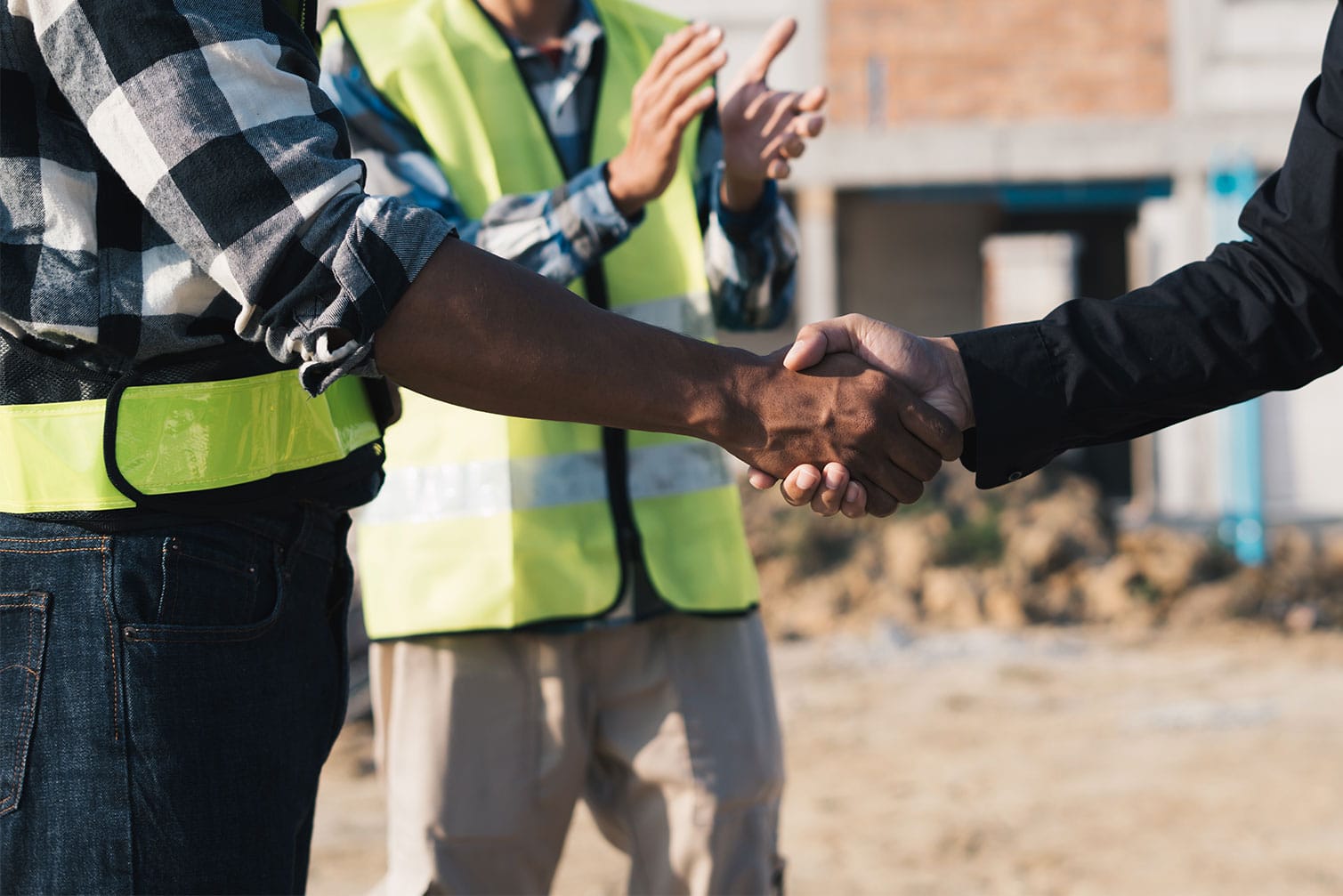 Landscaping contractor shaking hands with a new client